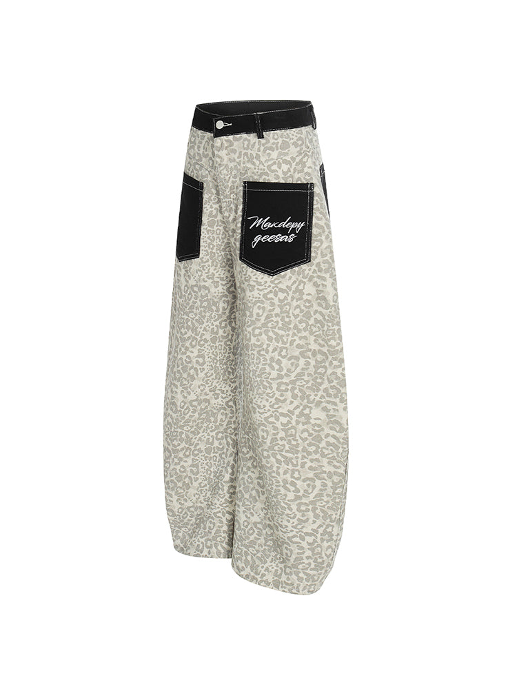 Rear view of light khaki leopard print baggy pants showcasing the black utility pocket design.
