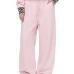 close up of pink cloud leopard baggy wide leg sweatpants with effortless pool at the ankle drape and pockets