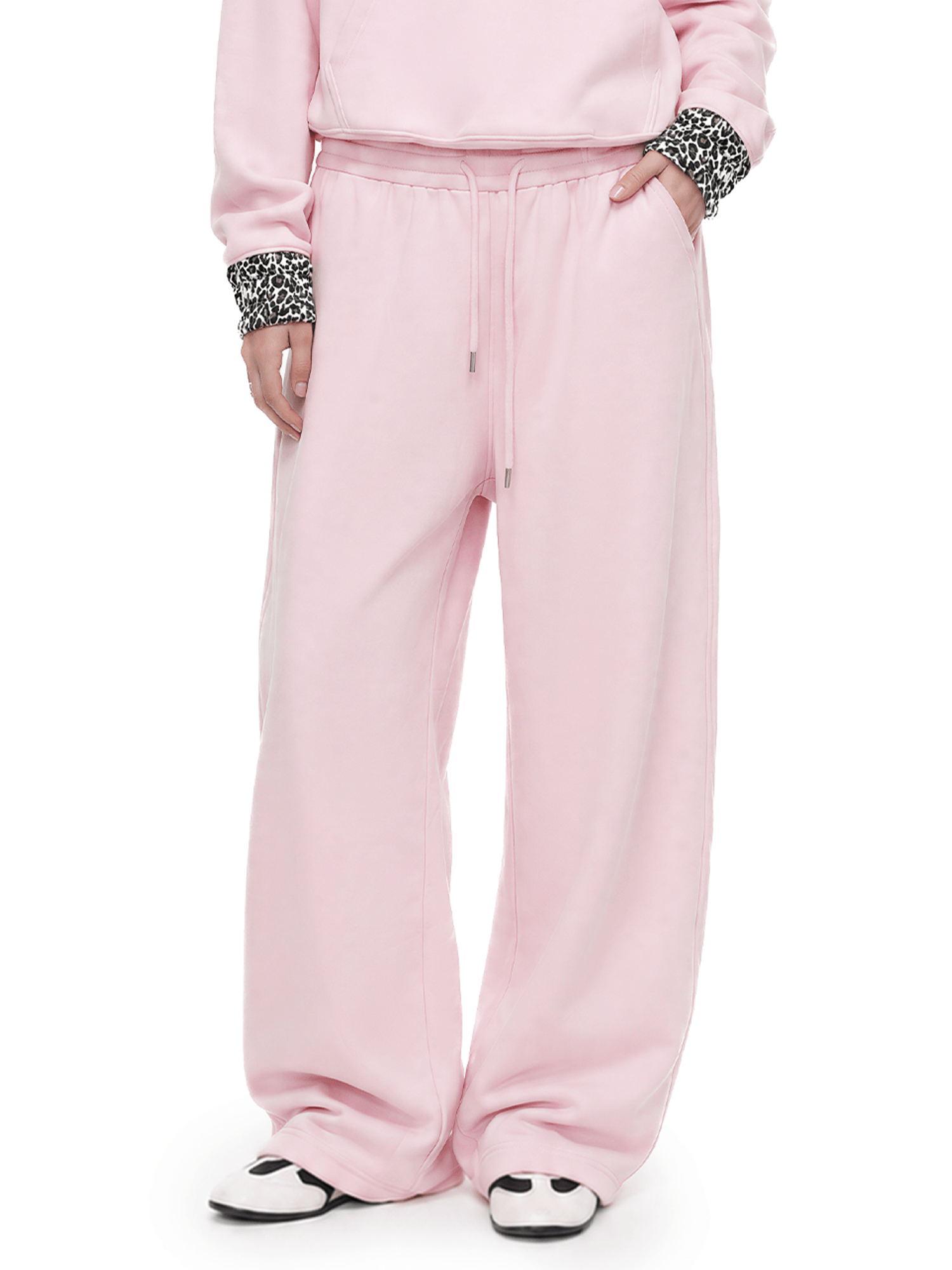 close up of pink cloud leopard baggy wide leg sweatpants with effortless pool at the ankle drape and pockets