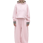 cyber y2k style women unisex pastel pink matching sweatsuit with relaxed drop shoulder design and baggy bottoms