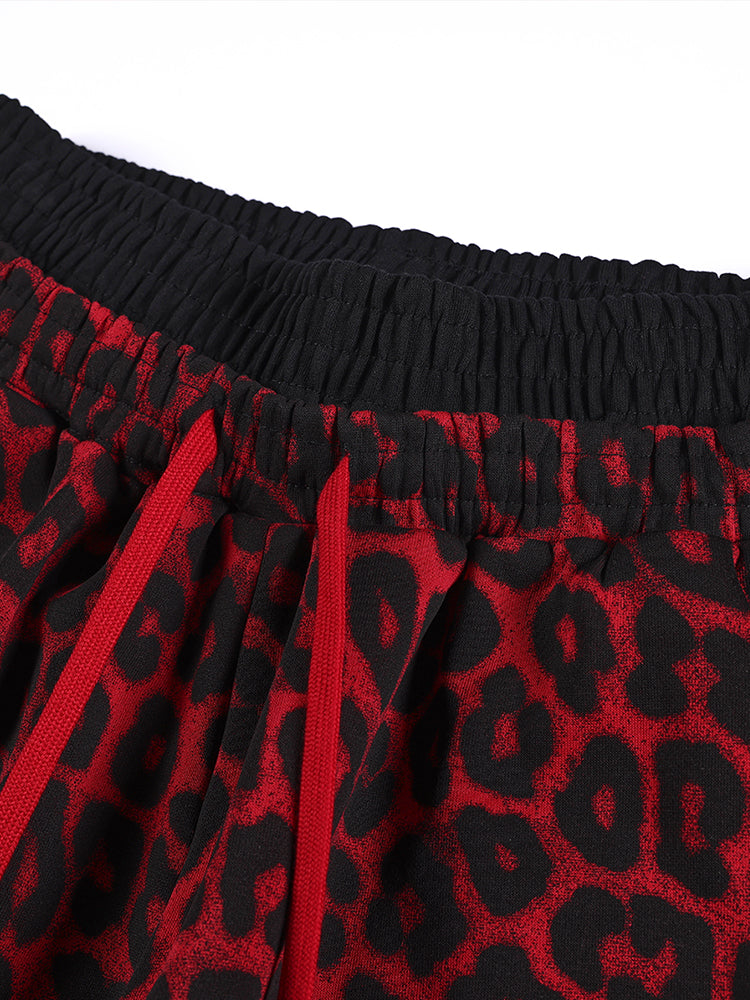 Close-up of elastic waistband on red leopard print high-street trousers