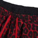 Close-up of elastic waistband on red leopard print high-street trousers