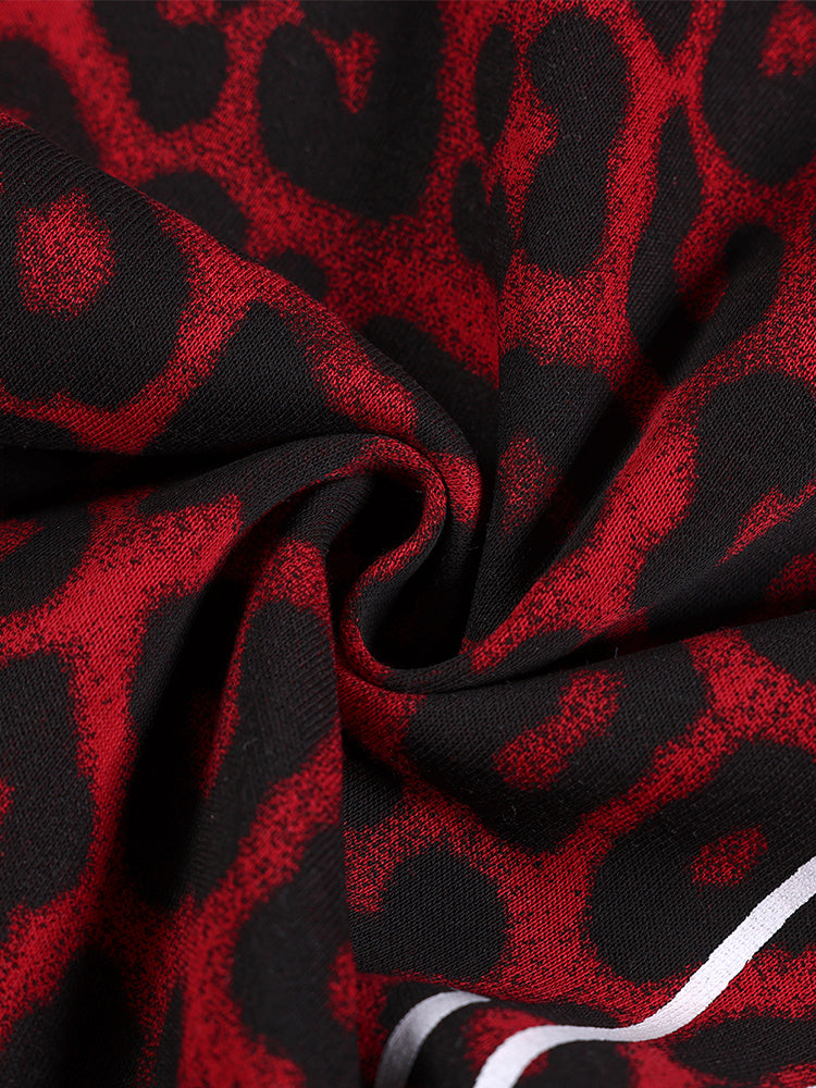 Texture shot of premium leopard print streetwear fabric, red and black