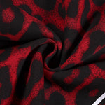 Texture shot of premium leopard print streetwear fabric, red and black