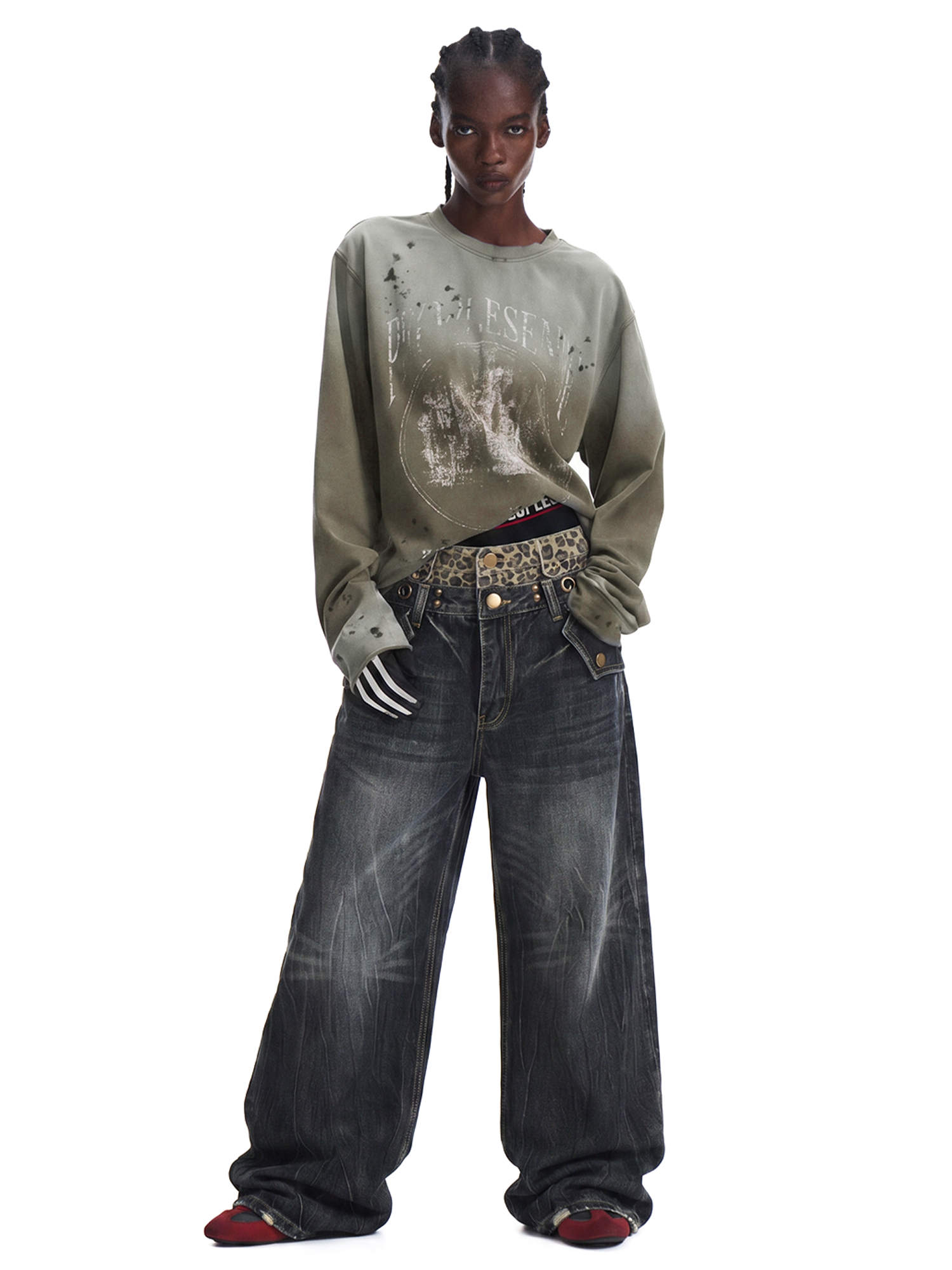 Full-length front view of a model in charcoal grey wide-leg denim jeans and a long-sleeve neutral top.