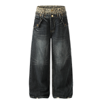 Front product shot of dark wash charcoal baggy jeans with an elasticated leopard print waistband.