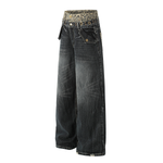 Side profile product shot of dark grey oversized denim trousers showing the voluminous leg shape.
