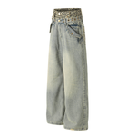Light blue jeans with a patterned belt on a white background