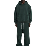 Male model in dark green heavyweight hoodie and straight-leg sweatpants set