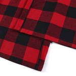 Detailed shot of the hem and heavy-weight fabric texture of red plaid streetwear pants.
