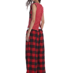 Rear view of red checkered wide-leg trousers on model showcasing the relaxed streetwear vibe.