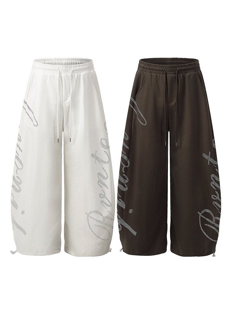 Comparison of oversized wide-leg sweatpants in both white and dark brown colors.