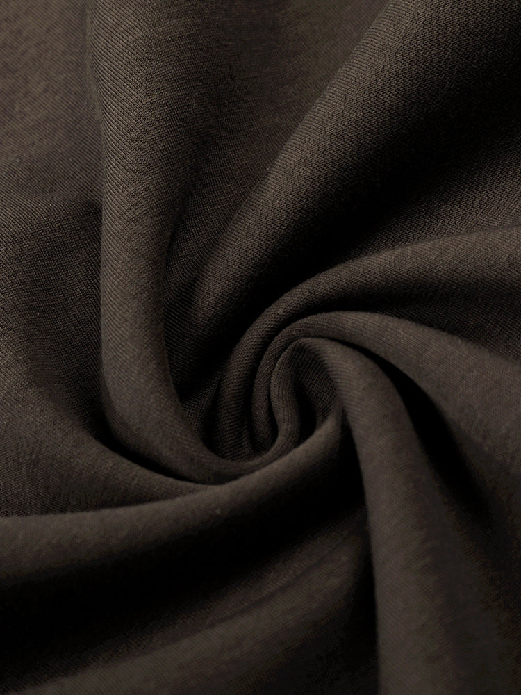 Texture en gros plan d'un tissu en molleton de coton marron foncé de haute qualité pour les pantalons de jogging
