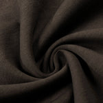 Close-up texture of high-quality dark brown cotton fleece fabric for sweatpants.