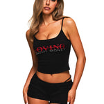 Side view of woman wearing black two-piece bodycon tank top and shorts set showing slim fit profile.