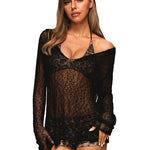 Close-up front view of a woman wearing a black sheer crochet mesh long sleeve cover-up over a bikini.
