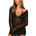 Close-up detail shot of the crochet knit texture and neckline of the black sheer festival top.