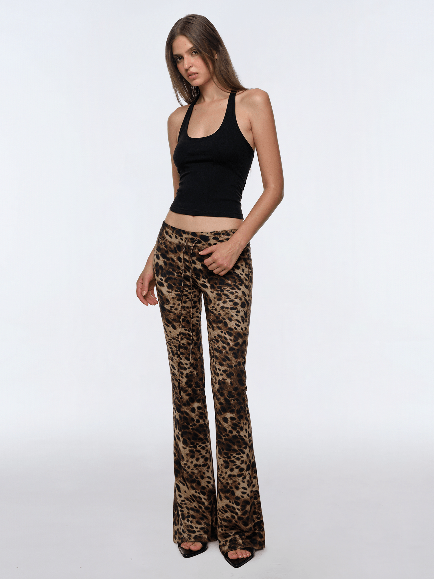 Back view of model wearing Leopard Low-Rise Flare Pants - FDR