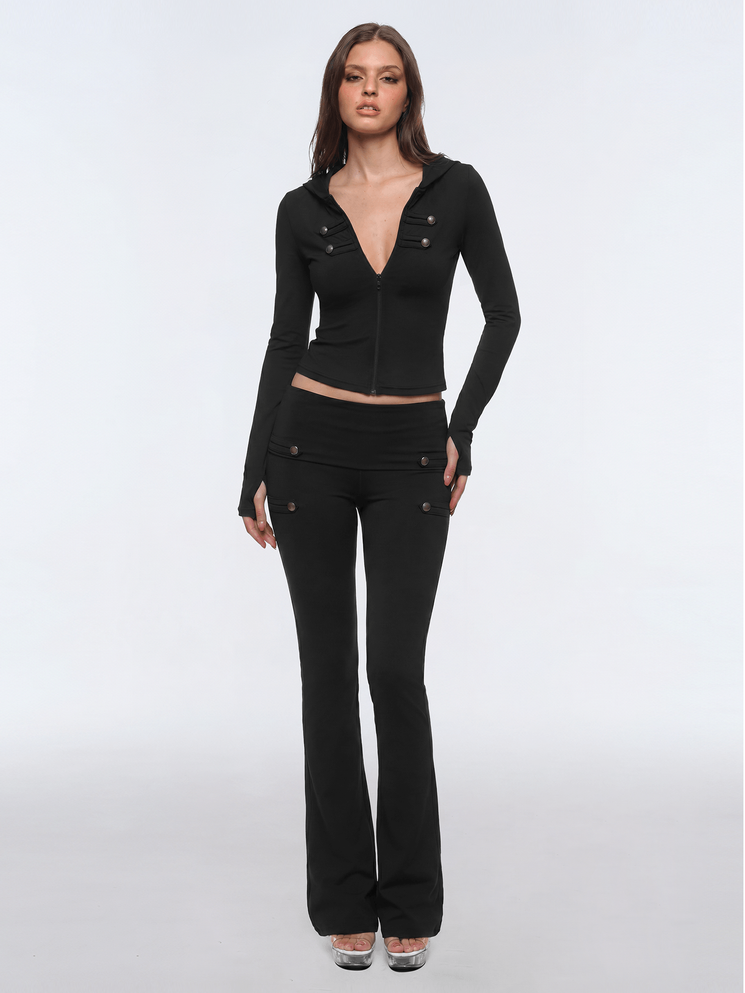Front view of model wearing Fold-Over Zip Yoga Jacket in White - FDR