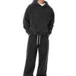 Man wearing classic black oversized streetwear hoodie and matching black pants