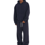 Male model posing in navy blue heavy cotton hoodie and sweatpants set