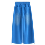 Minimalist back design of FDR Studios blue baggy trousers for unisex streetwear outfits.
