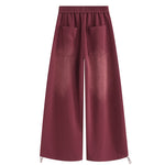 Back view of FDR Studios burgundy oversized sweatpants, minimalist industrial design with adjustable drawstring.