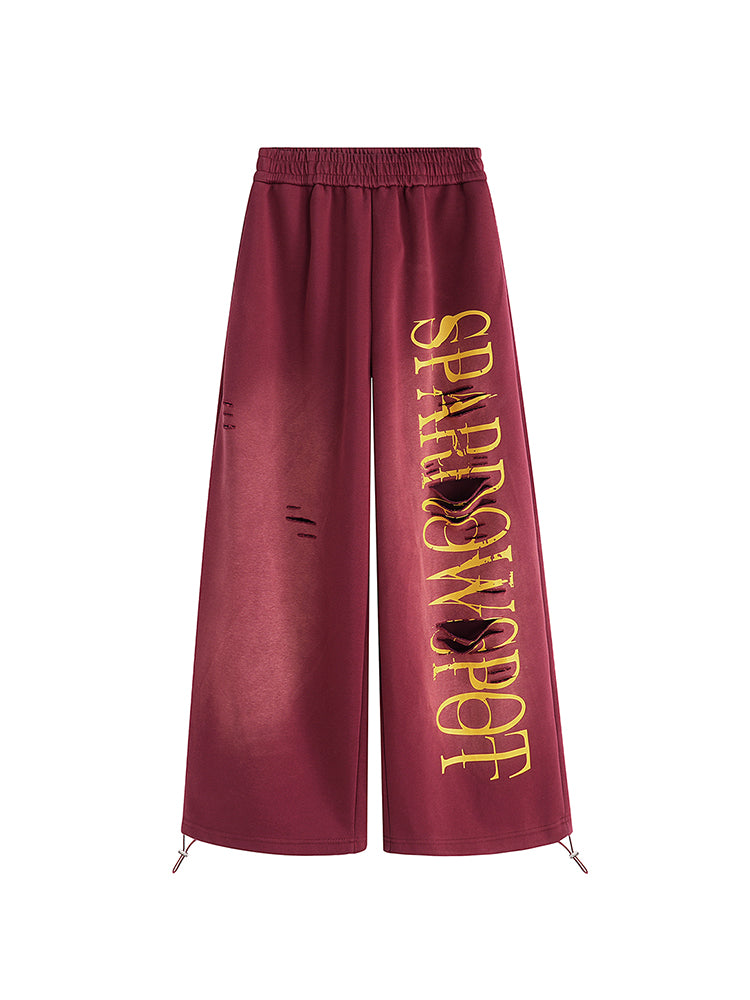 FDR Studios burgundy wide-leg joggers with yellow graphic embroidery, techwear inspired streetwear pants.