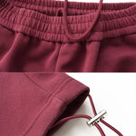 Technical details of FDR Studios sweatpants featuring adjustable toggles and premium drawstring hardware.