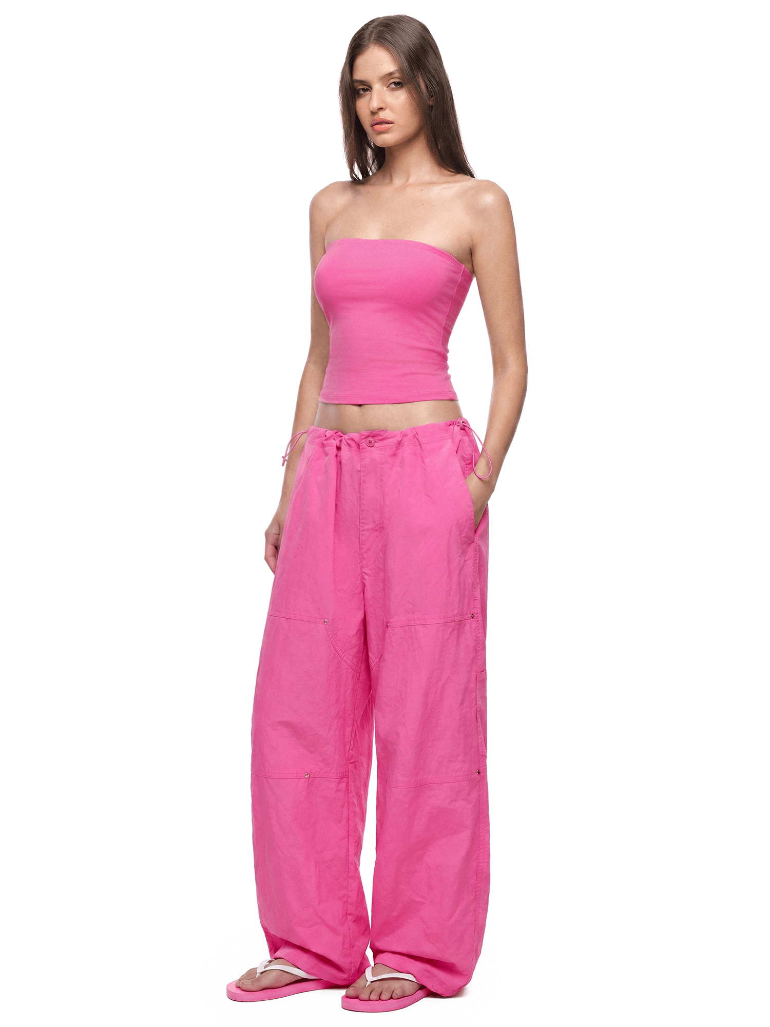 Front view of model wearing Baggy Parachute Cargo Pants in Rose - FDR