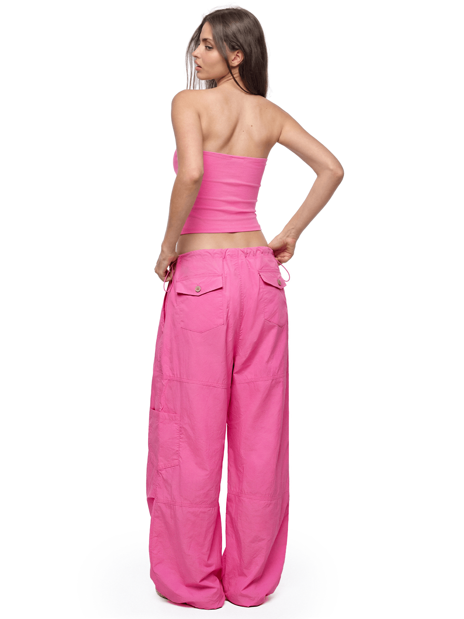 Back view of model wearing Baggy Parachute Cargo Pants in Rose - FDR