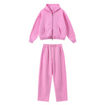 Vibrant pink oversized lounge set with zip-up hoodie and pants.