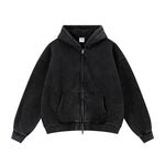 Flat lay of a premium black zip-up hoodie with oversized fit and kangaroo pockets.