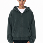 Close-up of a forest green heavy-weight oversized zip-up hoodie on model.