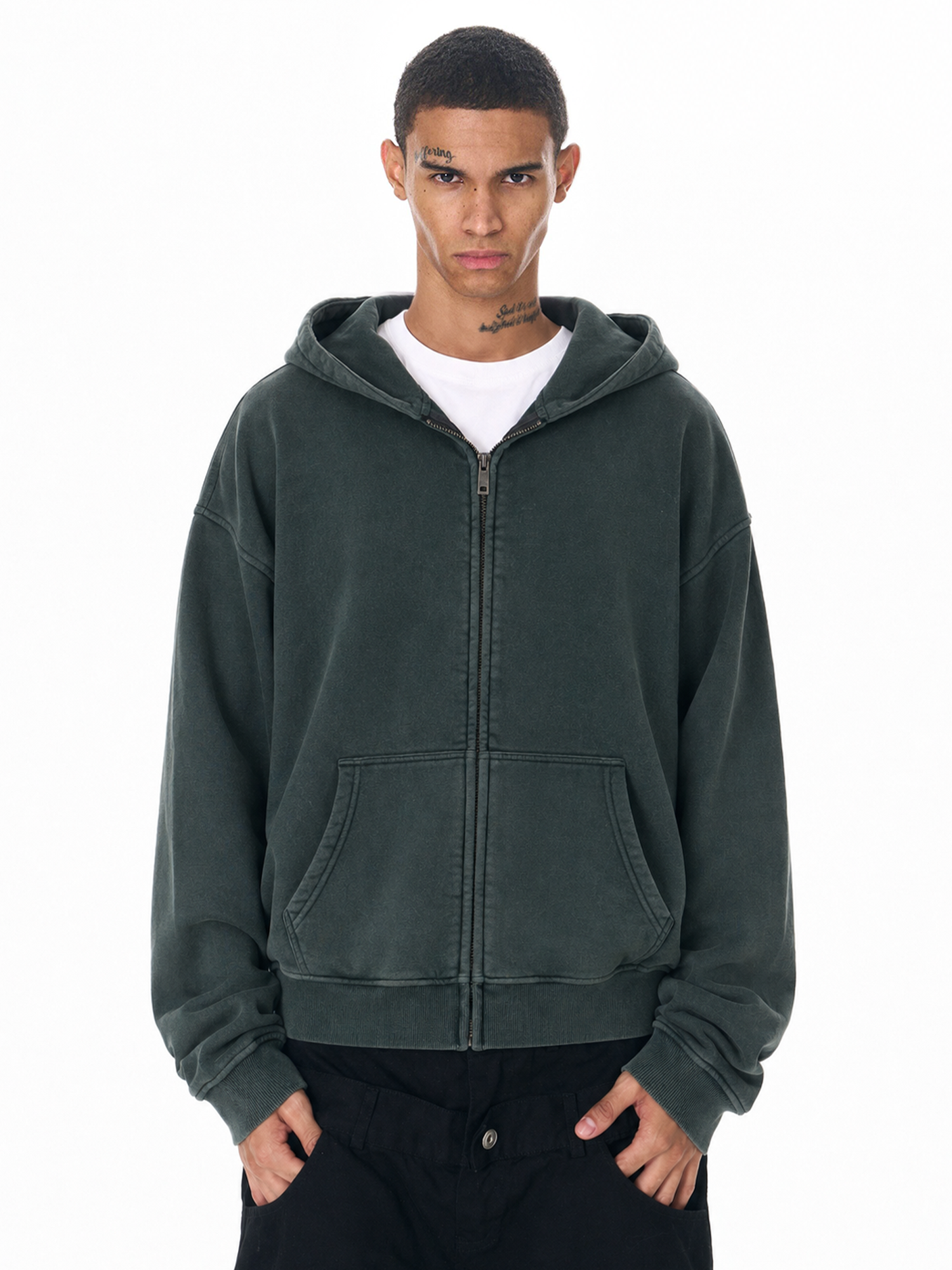 Close-up of a forest green heavy-weight oversized zip-up hoodie on model.