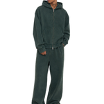 Male model wearing a forest green full-zip hoodie and matching baggy sweatpants.