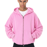 Close-up view of a bright pink oversized zip-up hoodie for streetwear.