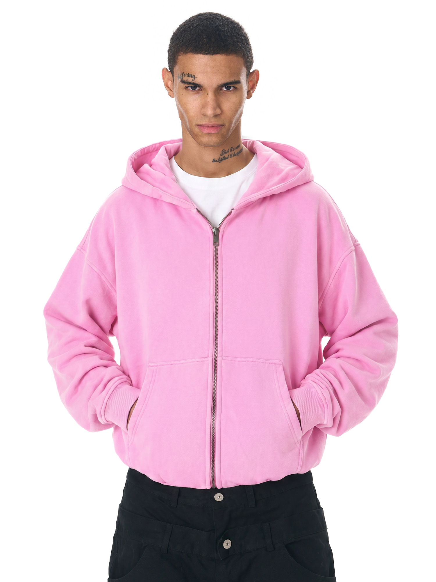Close-up view of a bright pink oversized zip-up hoodie for streetwear.