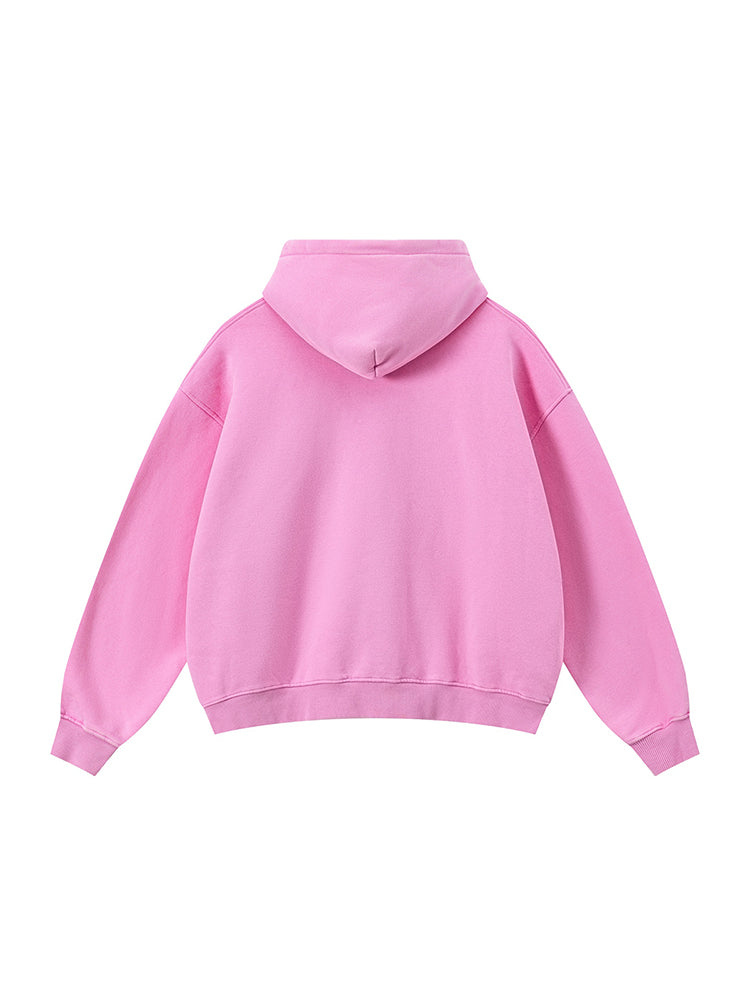 Pastel pink oversized streetwear zip-up hoodie flat lay.
