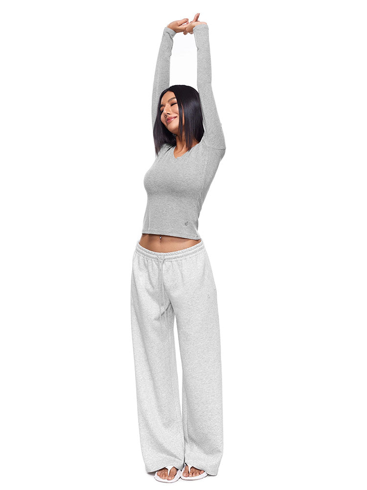 Side profile shot of a model in FDR Studios Heather Grey wide-leg sweatpants, highlighting the relaxed, high-waisted fit and premium soft fabric texture. Ideal for both home and streetwear.