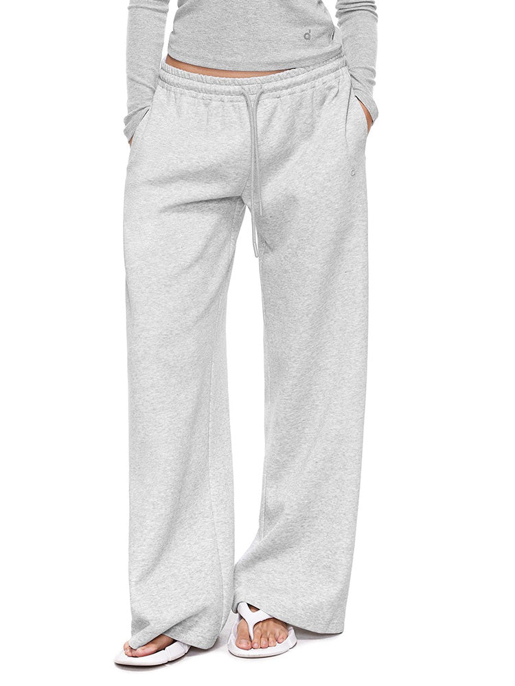 Full-body photo of a model showcasing the Heather Grey variant of FDR wide-leg sweatpants with pocket, paired with a matching long-sleeve crop top. A versatile and breathable women's loungewear essential.