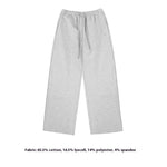 A neat flat-lay presentation of light grey wide-leg sweatpants, showing the drawstring waist and clean finish of these premium women's casual trousers.