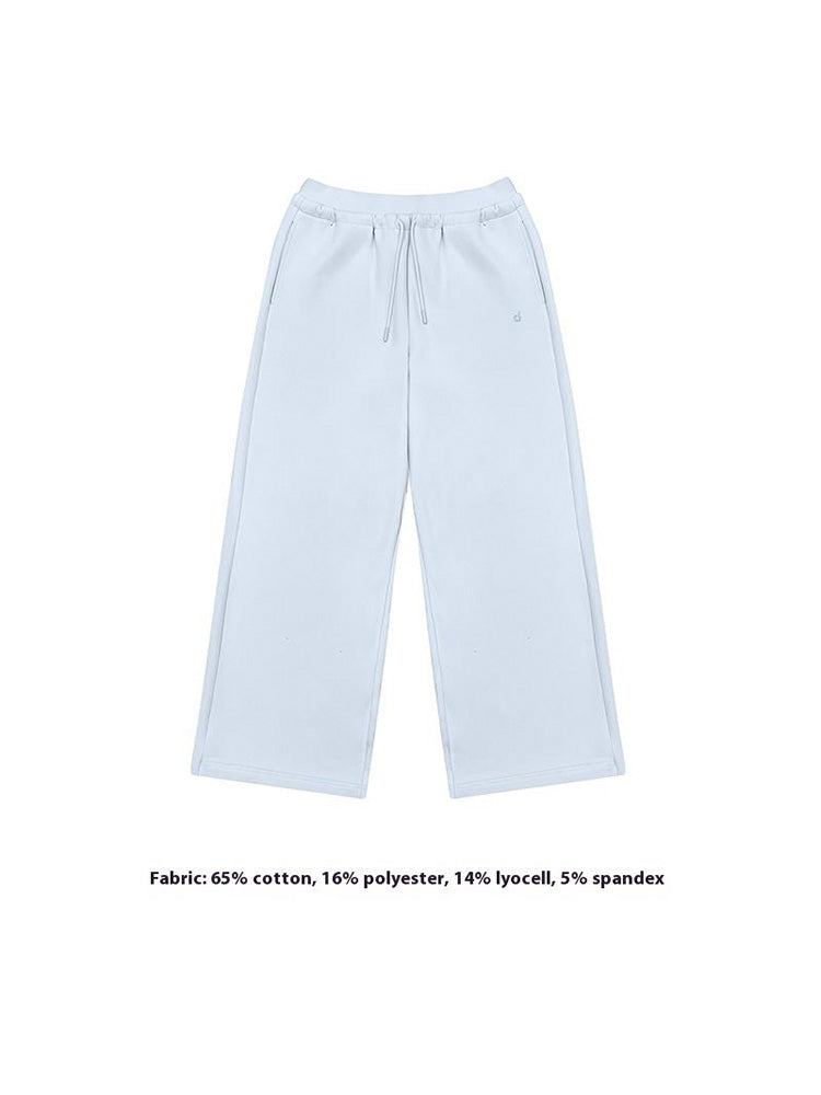 A simple flat-lay image of soft light blue wide-leg sweatpants, featuring an adjustable drawstring waist. A stylish and comfortable option for modern women's loungewear collections.