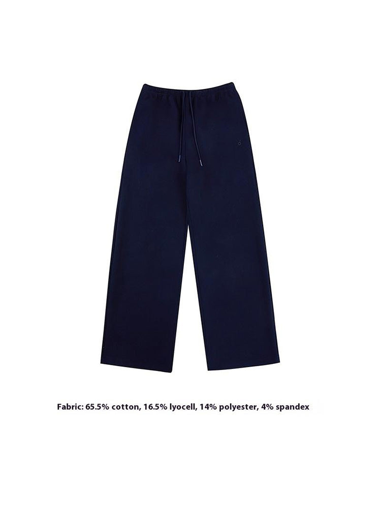 Product image flat-lay of deep navy-blue wide-leg sweatpants, featuring an adjustable drawstring waist and clean lines for a sophisticated women's casual trousers option.