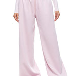 A direct front view of a model showcasing the complete FDR Studios soft pink wide-leg sweatpants set. Highlighting the comfort and clean silhouette of this versatile loungewear.