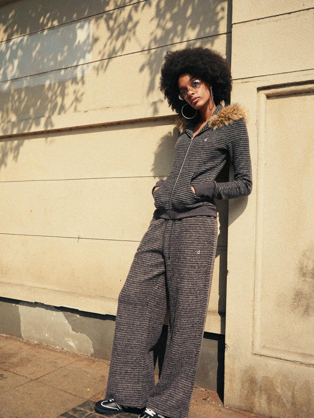 Full streetwear tracksuit featuring a grey oversized zip-up and matching sweatpants.