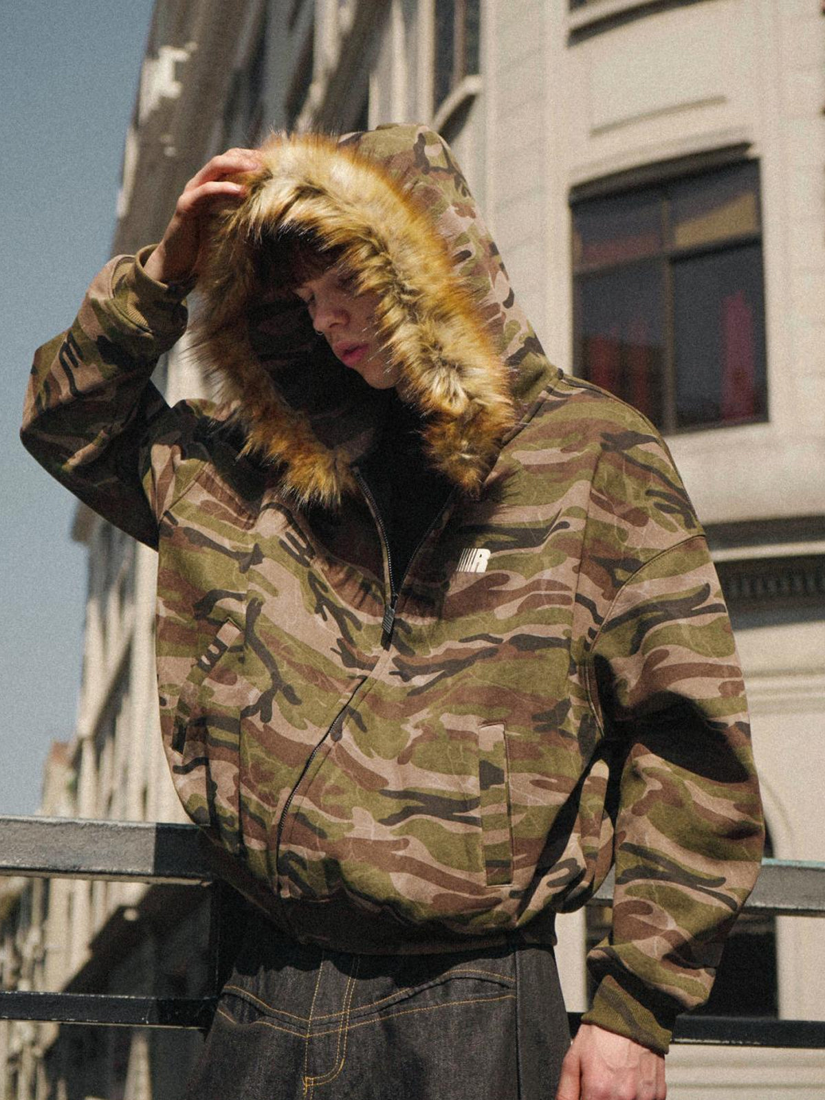 Rear view of an oversized hoodie showing the clean back panel and urban fit.