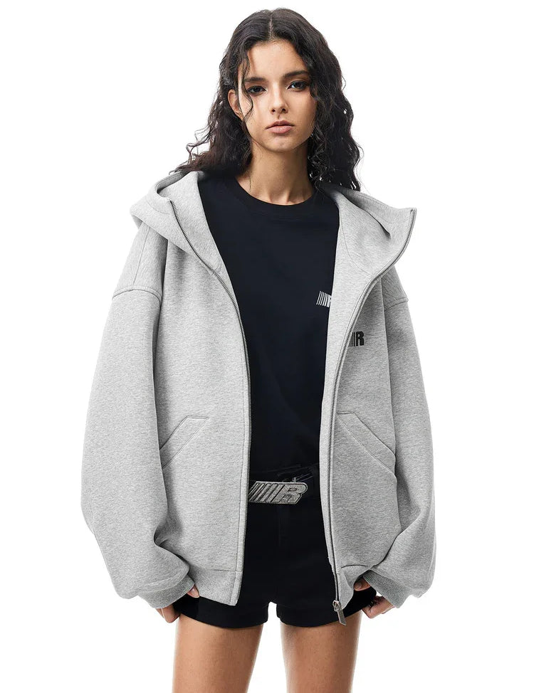 Multiple angles of model in grey high-neck hoodie, showcasing structured fabric and minimalist design.
