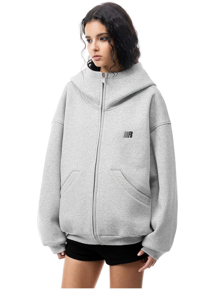 Multiple angles of model in grey high-neck hoodie, showcasing structured fabric and minimalist design.