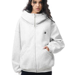 Model wearing light gray structured hoodie, presenting a bright Y2K high-street fashion look.